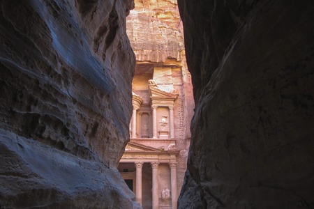 Stunning view from a cave of the Ad Deir - Monastery in the ancient city of Petra, Jordanの写真素材