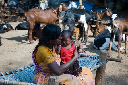 Hampi, India - February 4 2009: Candid portrait of a Mother and her Girl child.