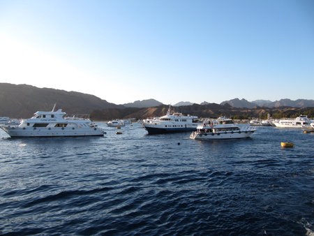 SHARM EL SHEIKH, EGYPT - december 29, 2009:several beautiful white yachts moored in the sea against...