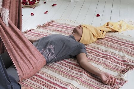 Doula massaging woman at home.の写真素材