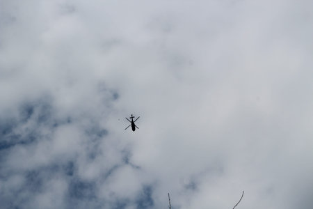 silhouette of big military helicopter in the sky.