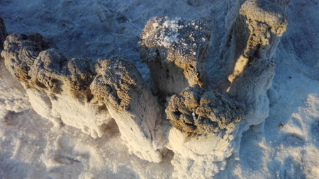 Abandoned remains of wooden structures on a salt lake.