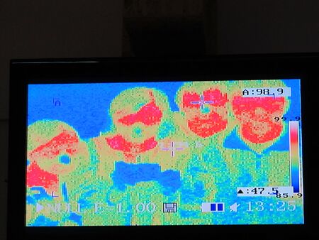 images of people in a thermal imager. Thermographic image of human face.の写真素材