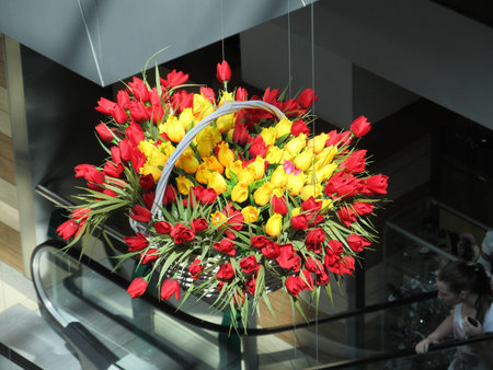 bouquet of tulips is suspended in the air as the decor of a shopping center