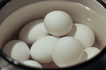 White eggs are boiled in water for Easter.