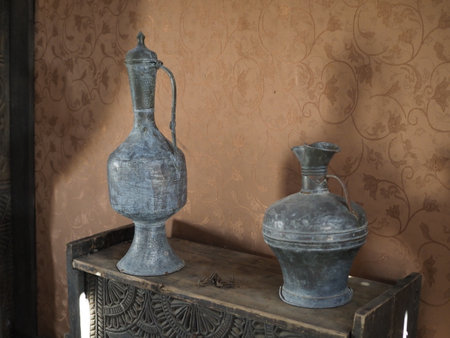 Antique Ancient Old Historical Items on Table. Vintage photo. Tools of ancient peoples. Old Retro Ancient Historical Jug in old table footage.の写真素材