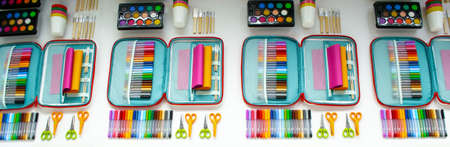 Moscow, Russia, October 2020: Bright multi-color IKEA stationery - watercolors, markers, pencils and scissors with colored paper.のeditorial素材