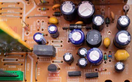 Moscow, Russia, September 2020: Close - up of details inside the VCR. Transistors, microchips, etc. Technological abstract background.のeditorial素材