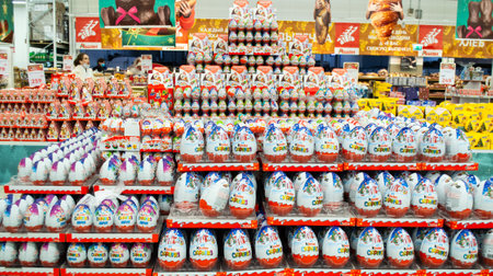 Moscow, Russia, November 2020: Many huge chocolate eggs Kinder surprise of a bunch of food. Holiday sale.のeditorial素材