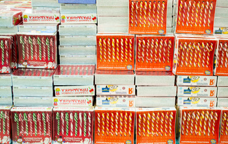 Moscow, Russia, November 2020: Many striped Candy canes in boxes. Christmas candy sale.のeditorial素材