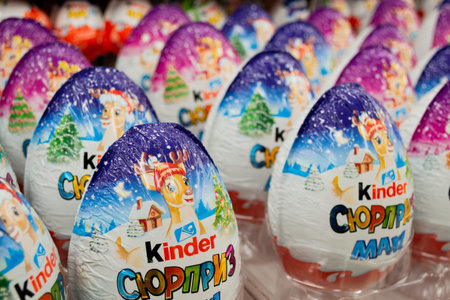 Moscow, Russia, November 2020: Close-up of many Kinder surprise chocolate eggs in Christmas...
