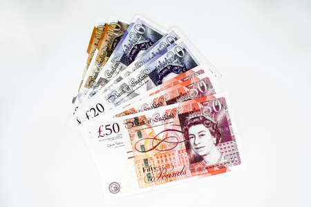 Moscow, Russia, February 2020: A pile of ten, twenty and fifty pound notes.のeditorial素材