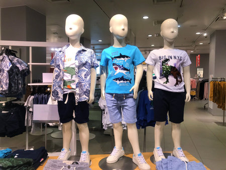 Moscow, Russia, July 2019: Three mannequins boys in a clothing store.