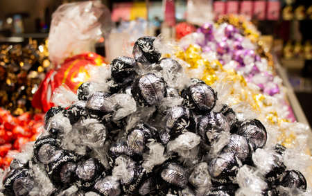 Moscow, Russia, February 2021: A bunch of assorted lindt chocolates with different fillings. Sale in a branded candy store.のeditorial素材