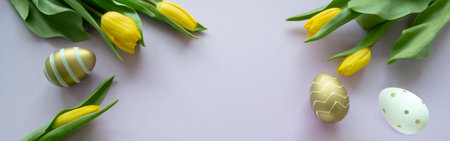 Banner with Easter eggs of gold, white color with a pattern and yellow tulips on a pink, lilac background. copyspace.の写真素材