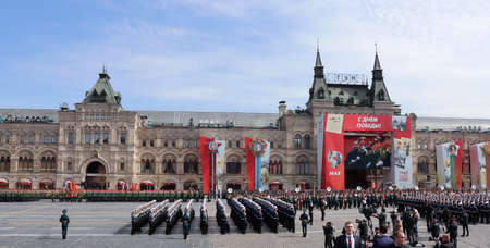 Moscow, Russia, May 2022: The main rehearsal of the military parade. Cadets of the Naval Military School march in formation across Red Square. TV journalists are broadcasting.のeditorial素材