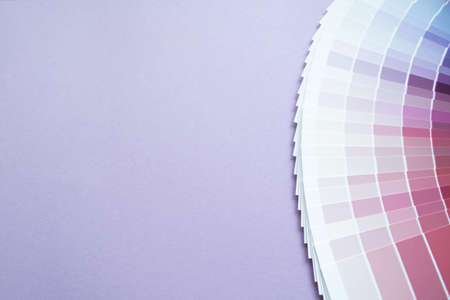 Paint sample colors swatch for interior design. Lilac background, copy space. Multicolored abstract wallpaper. Blue pink and purple - violet or lilac tone colors.の写真素材