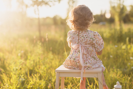little girl on the nature, sunsetの写真素材