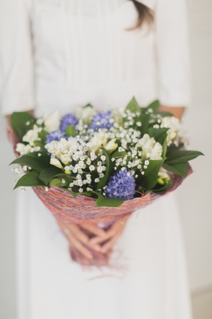 bride holding a bouquet of flowersの写真素材