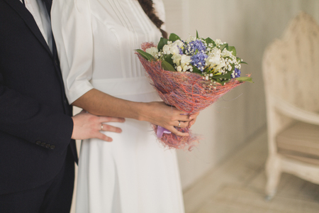 bride holding a bouquet of flowersの写真素材