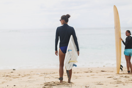 Two Beautiful young girls surfersの写真素材