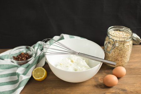 Ingredients for cheese casseroles, oatmeal, cottage cheese, eggs and raisins