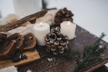 Wedding rings on wooden saw cutの写真素材