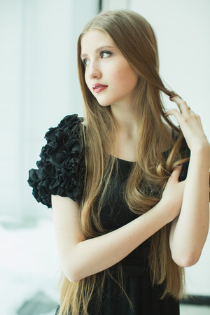 portrait of beautiful young girl in dressの写真素材