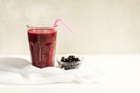 Glass of fresh black currant smoothieの写真素材