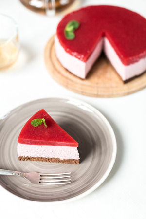 Delicious strawberry cheesecake on tableの写真素材