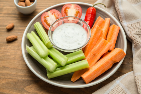 Vegetarian healthy snacks, vegetable snack: carrots, celery, tomatoesの写真素材