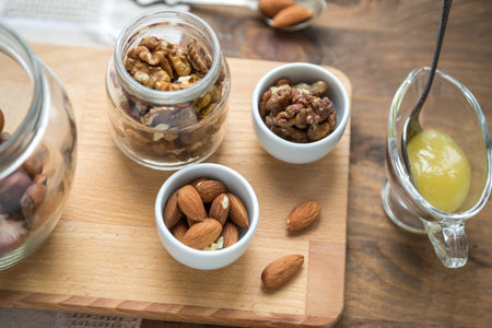 Assorted nuts: walnuts, almonds, hazelnuts and honey
