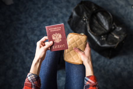 girl holding Russian passport and purseの写真素材