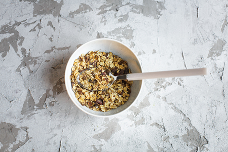 healthy breakfast: granola with cranberries in bowl の写真素材