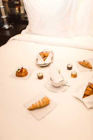 French breakfast in bed at hotelの写真素材