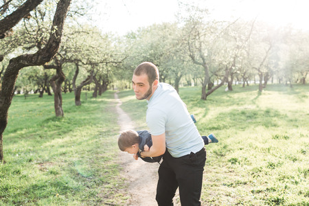 Father and son playing in the parkの写真素材
