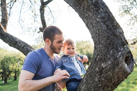Father and son playing in the parkの写真素材