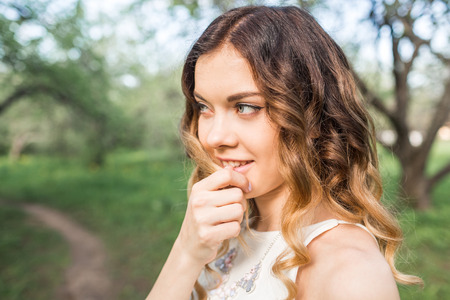 Beautiful girl walks in the gardenの写真素材