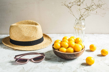 Fresh yellow cherry plum in a bowl close up