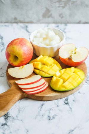 Dessert fruits: apples, mango, melonの写真素材