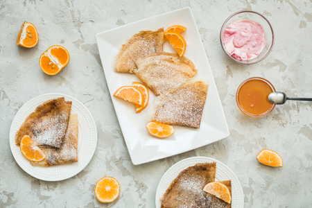 Russian national cuisine, Russian pancakes with orange and honey, top viewの写真素材