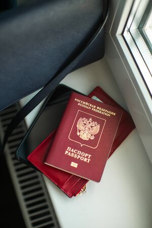 foreign passport and documents are on the windowsillの写真素材