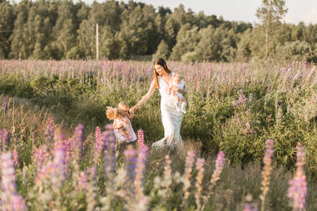 happy family, mother with two children, daughtersの写真素材