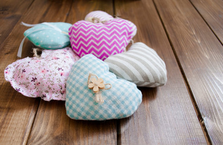 stitched hearts several pieces of handmade on a wooden table