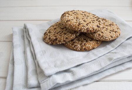 dry liver with sesame seeds on a napkin and a light wooden tableの写真素材