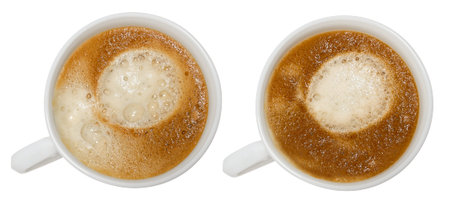 two white glass cups with coffee, with different foam, top viewの写真素材