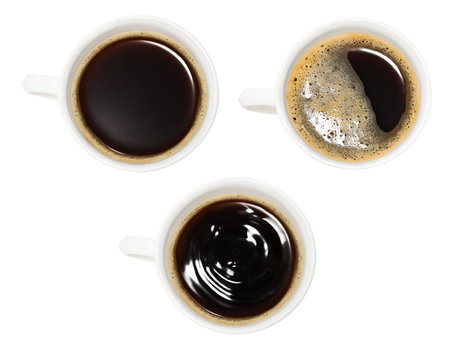 three white glass cups with: coffee with foam, coffee without foam, coffee with waves after a drop.の写真素材