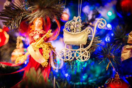 Christmas tree toy pram. Make a wish for a babyの写真素材