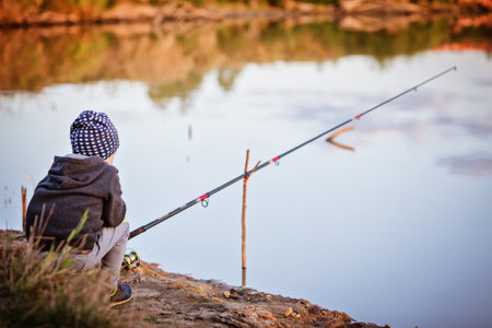 boy is fishing in the river. 5 years old Childs hobbyの写真素材