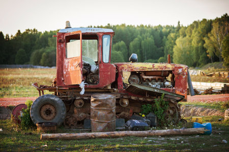 old abandoned broken tractor on a farmの写真素材